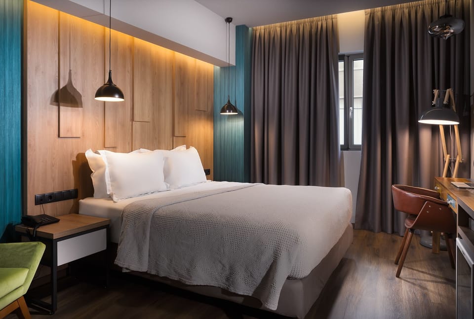 Deluxe Double Room | Living area | Flat-screen TV