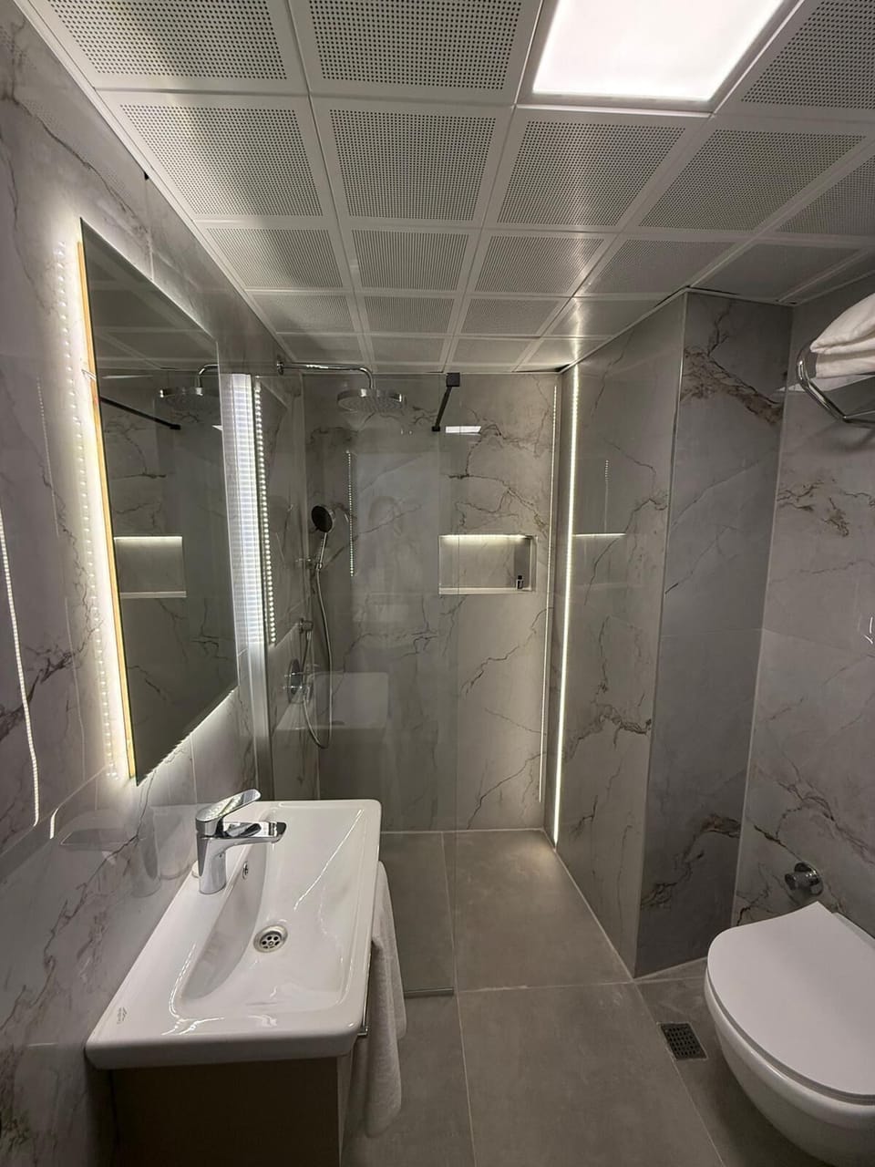 Shower, free toiletries, hair dryer, slippers