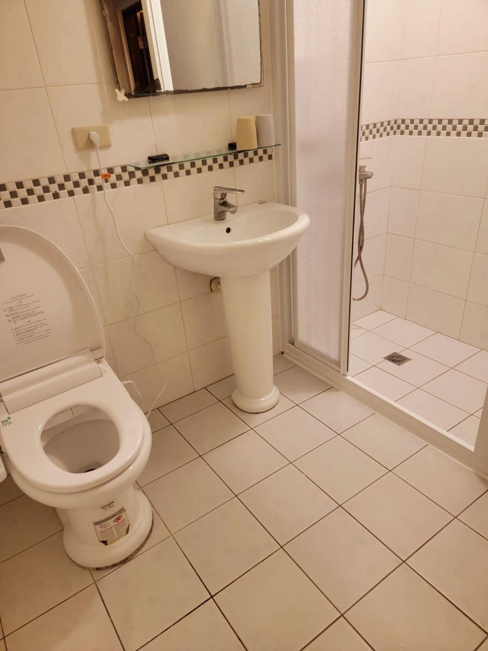 Shower, free toiletries, hair dryer, slippers