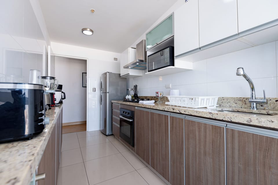 Apartment, 4 Bedrooms | Private kitchen | Coffee/tea maker, full-size fridge, microwave, oven