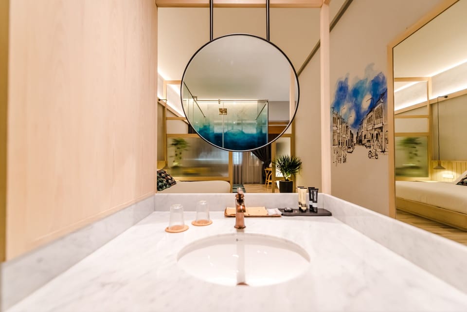 Courtyard Suite | Bathroom | Shower, free toiletries, hair dryer, bathrobes
