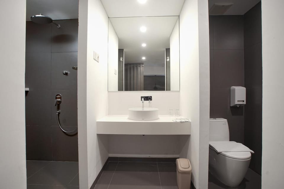 Shower, rainfall showerhead, slippers, towels