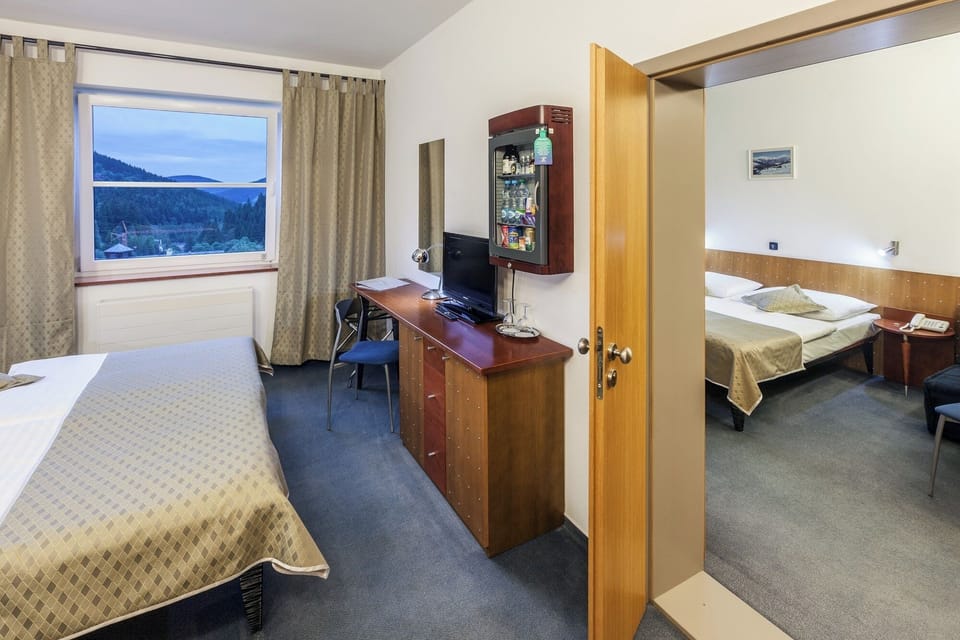 Family Room, 2 Bedrooms | Minibar, in-room safe, desk, blackout drapes