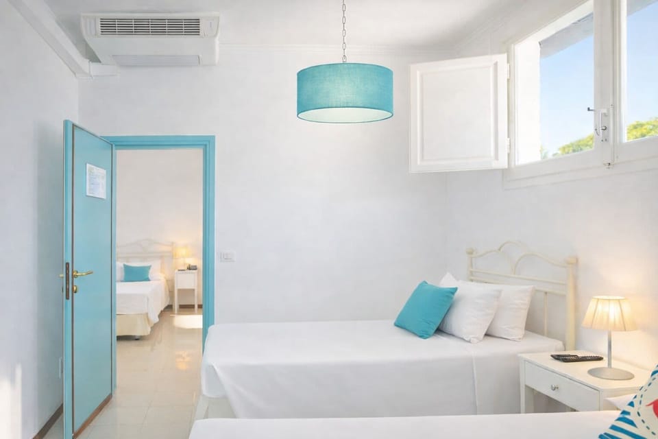 Basic Quadruple Room | Minibar, in-room safe, free WiFi, bed sheets