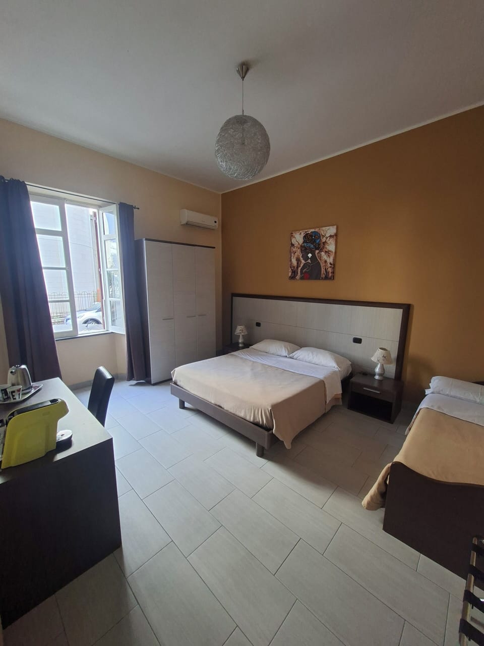 Triple Room | Minibar, in-room safe, desk, iron/ironing board