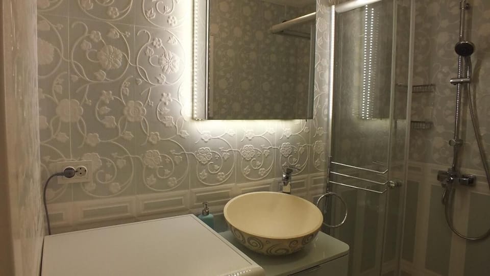 Shower, free toiletries, hair dryer, slippers