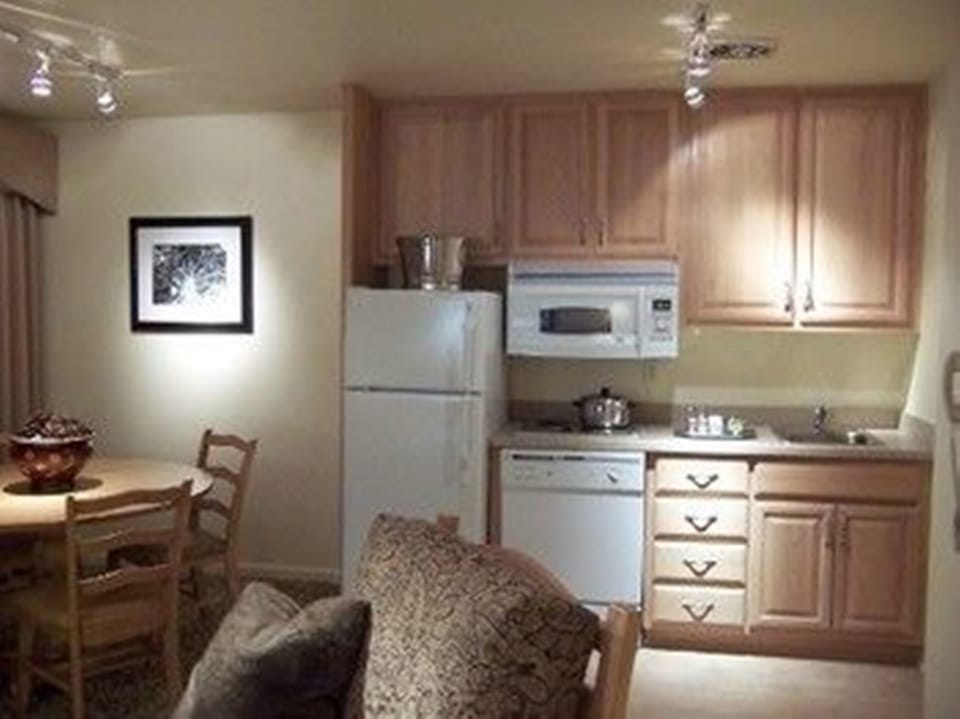 Full-size fridge, microwave, coffee/tea maker, cookware/dishes/utensils