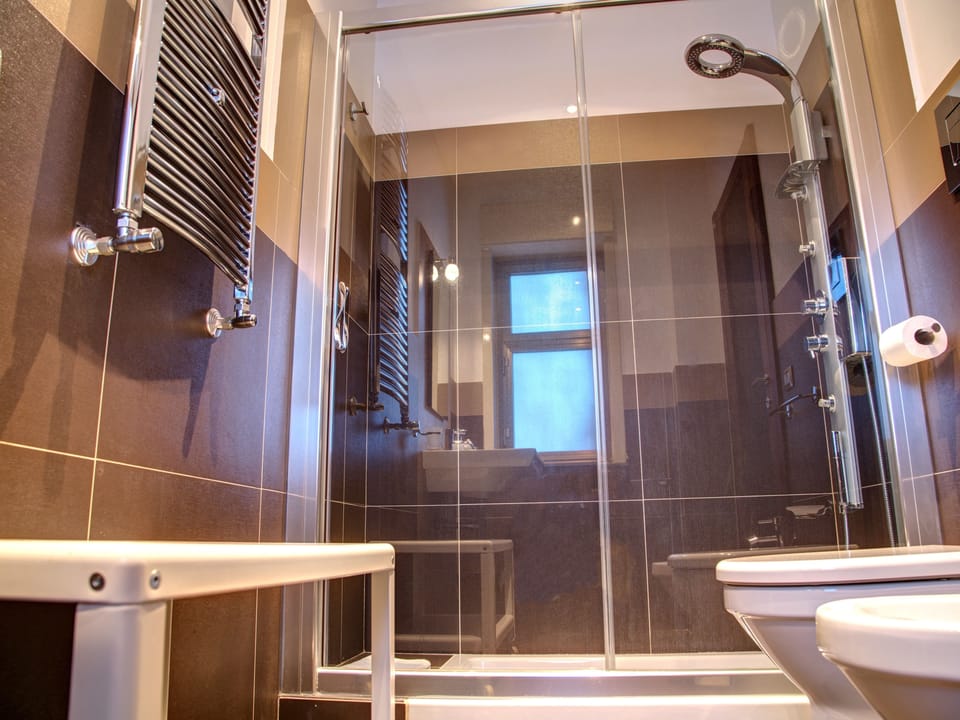 Quadruple Room | Bathroom | Shower, free toiletries, hair dryer, bathrobes