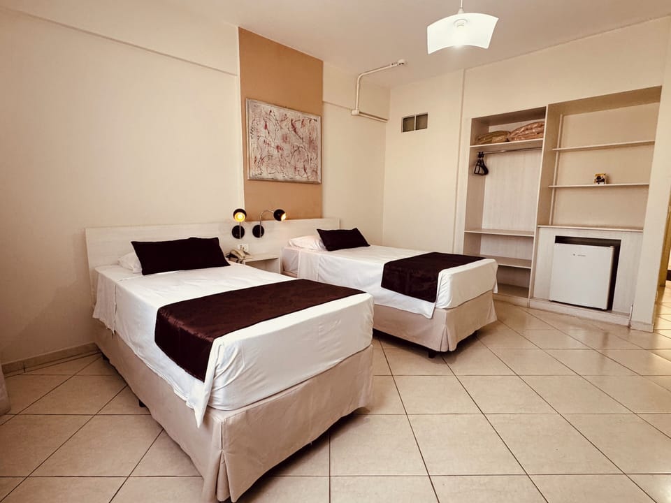 Standard Twin Room | Minibar, desk, laptop workspace, blackout drapes