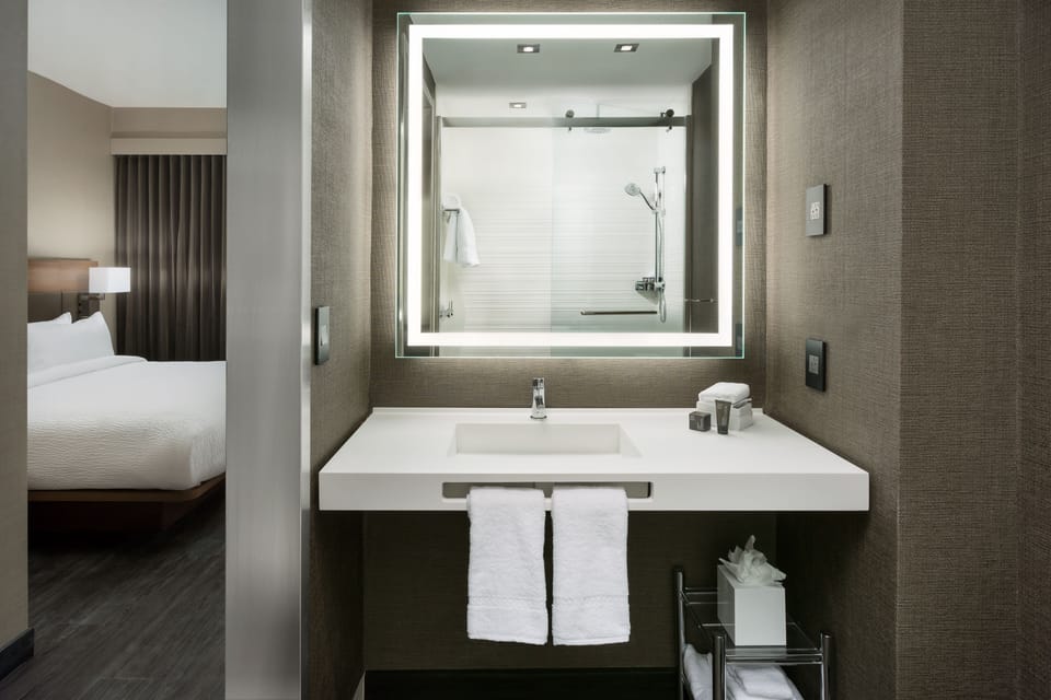 Shower, rainfall showerhead, eco-friendly toiletries, hair dryer