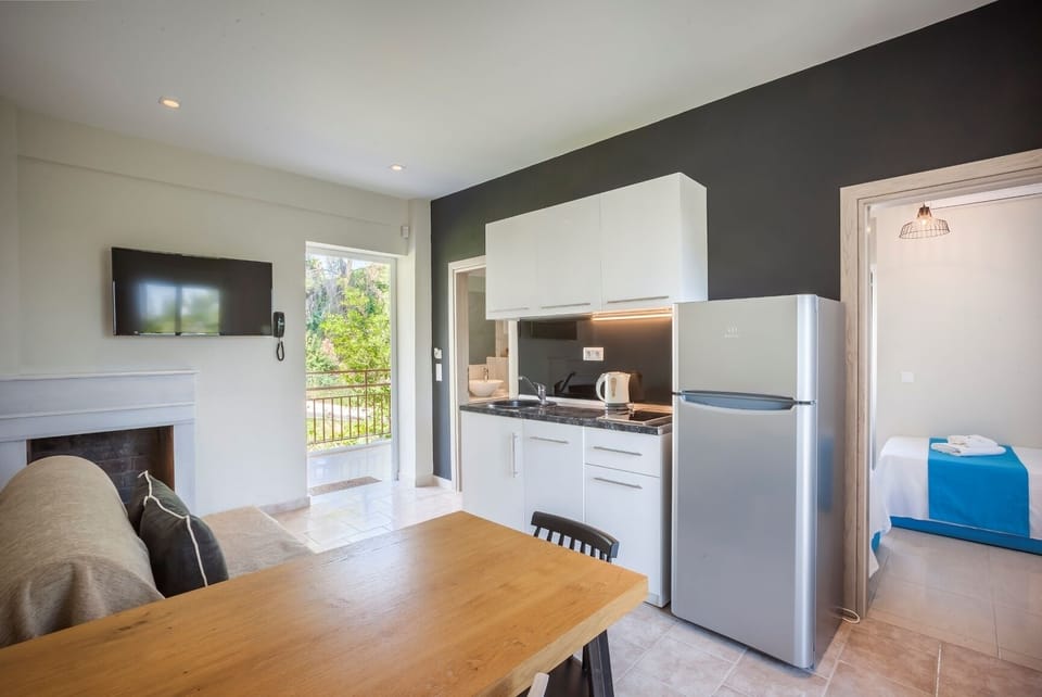 Suite, 2 Bedrooms | Private kitchen | Fridge, stovetop, electric kettle, cookware/dishes/utensils
