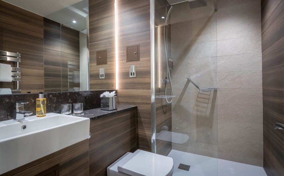 Shower, eco-friendly toiletries, hair dryer, towels