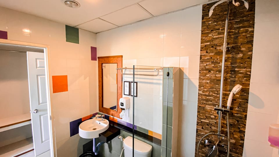 Shower, free toiletries, slippers, towels