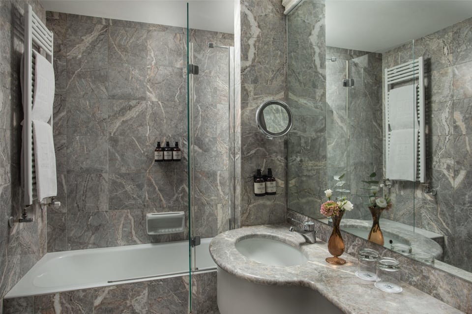 Eco-friendly toiletries, hair dryer, bidet, towels