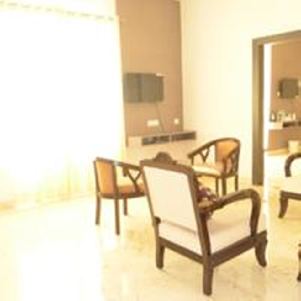 Suite, 1 Double Bed | Living area | TV