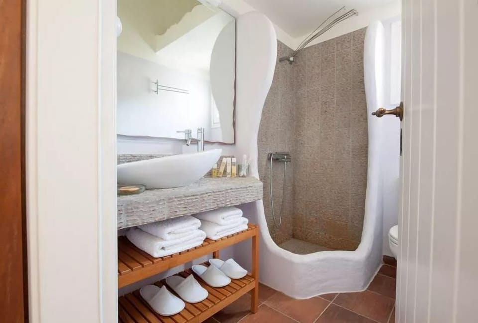 Shower, designer toiletries, hair dryer, bathrobes