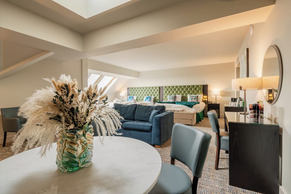 Family Room | Premium bedding, in-room safe, desk, iron/ironing board