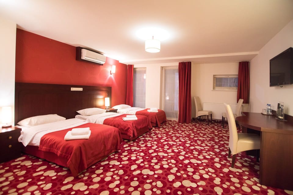 Triple Room | Premium bedding, in-room safe, desk, blackout drapes