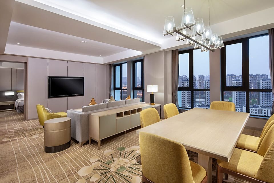 Suite, 1 Bedroom (Dining Area) | Minibar, in-room safe, soundproofing, iron/ironing board