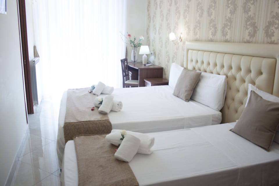 Deluxe Double or Twin Room | Minibar, in-room safe, individually decorated, desk