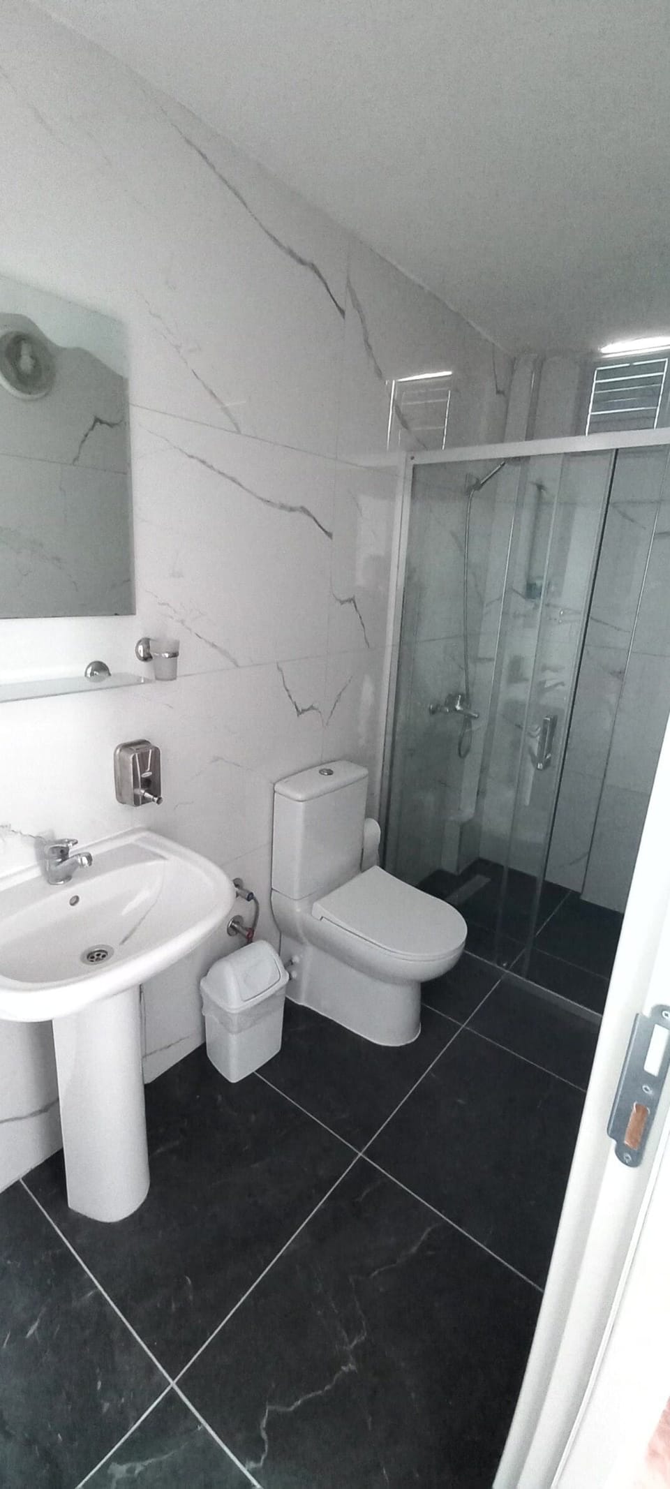 Shower, free toiletries, hair dryer, slippers