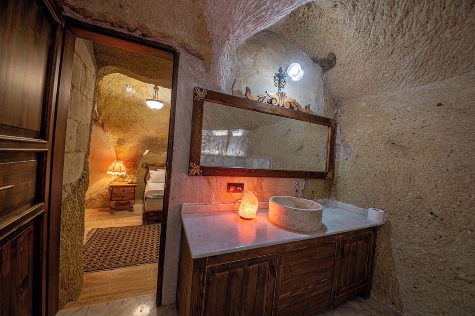 Luxury Room, 1 Queen Bed | Bathroom | Combined shower/tub, jetted tub, hair dryer, heated floors