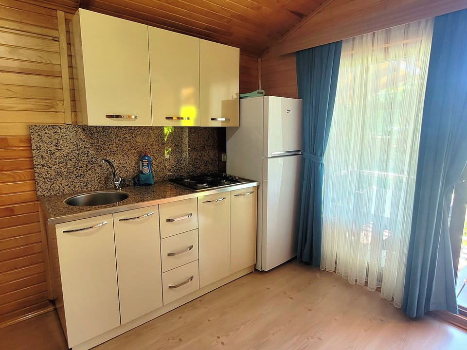 Superior Bungalow, 1 Bedroom, Kitchenette, Garden Area | Private kitchen | Fridge
