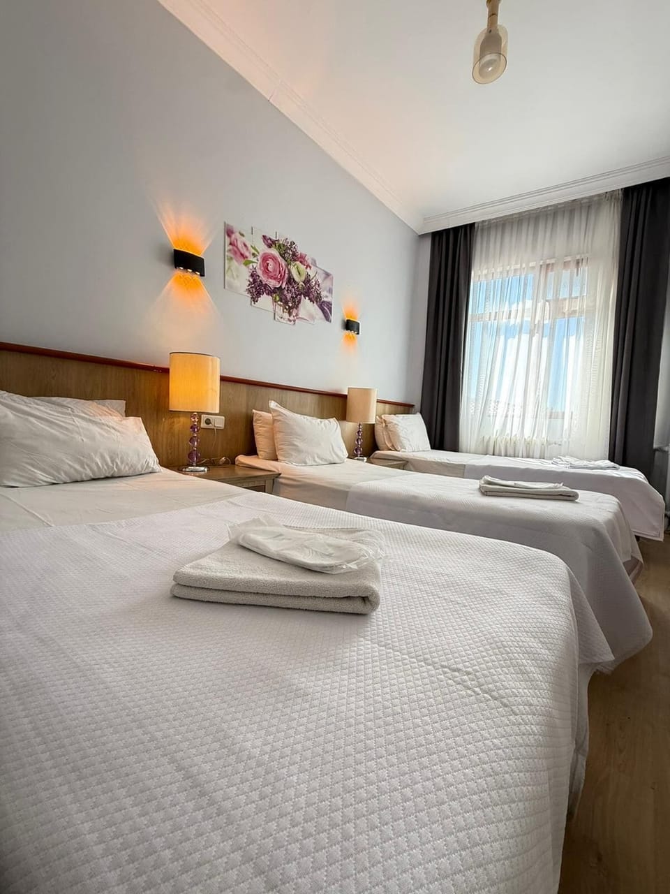 Standard Triple Room | Minibar, iron/ironing board, free WiFi, bed sheets