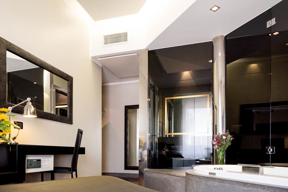 Junior Suite, Jetted Tub | Minibar, in-room safe, desk, soundproofing