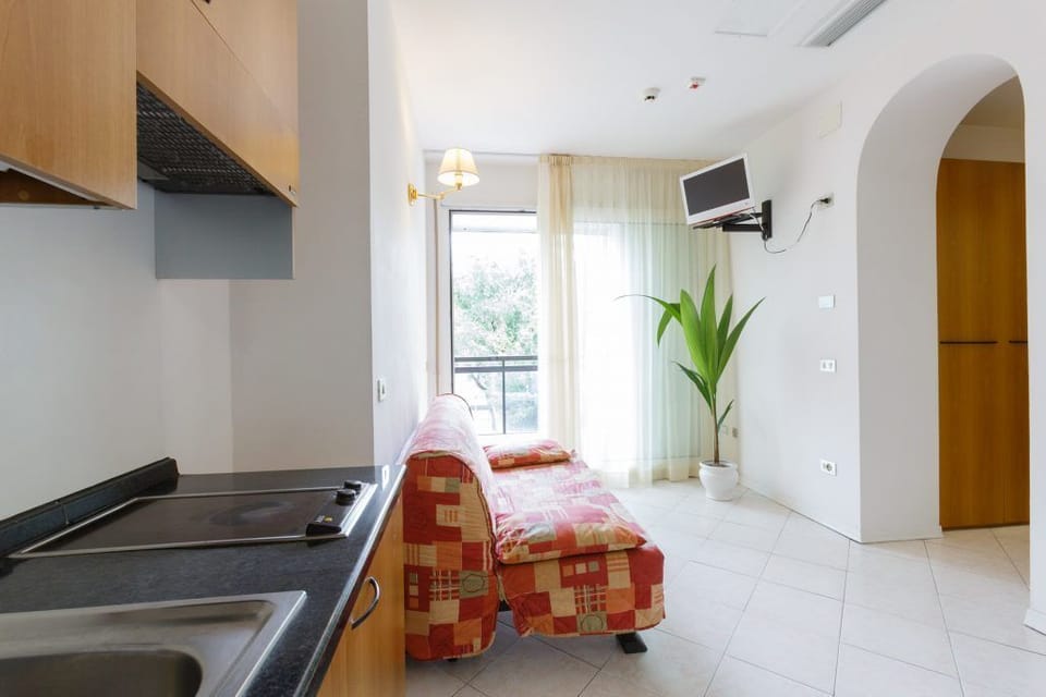 Apartment, 1 Bedroom, Garden View (4 pax) | Living room | LCD TV