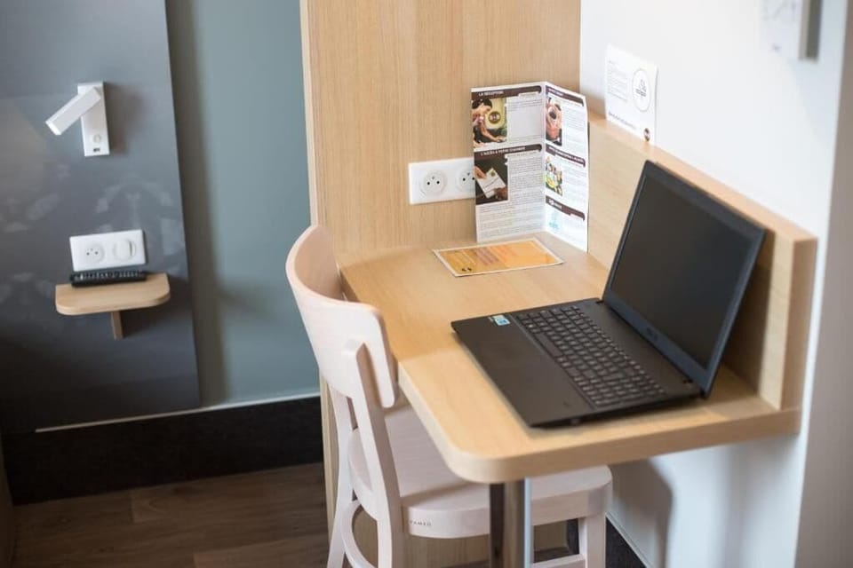 Desk, laptop workspace, blackout drapes, soundproofing