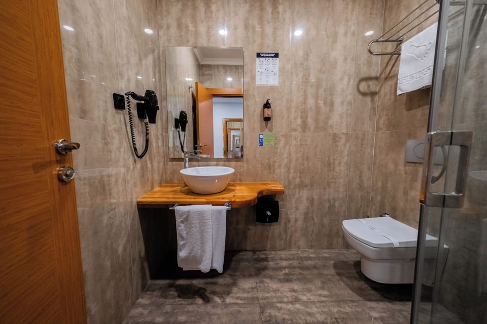 Shower, free toiletries, hair dryer, slippers