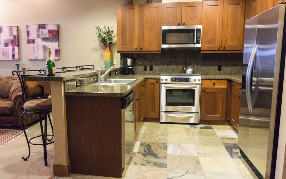 Condo, 1 Bedroom | Private kitchen | Full-size fridge, microwave, oven, stovetop