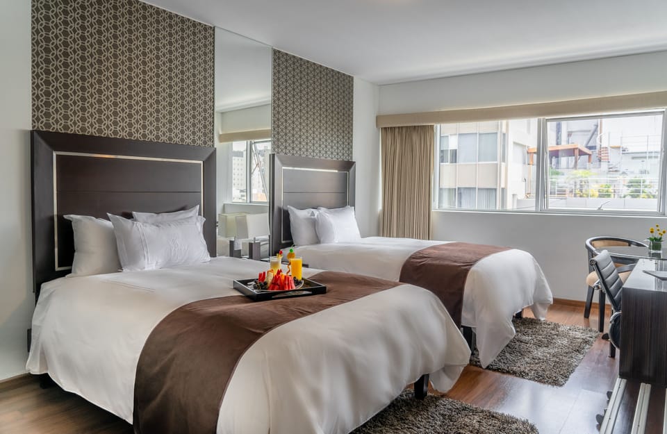 Twin Room | Minibar, in-room safe, desk, soundproofing