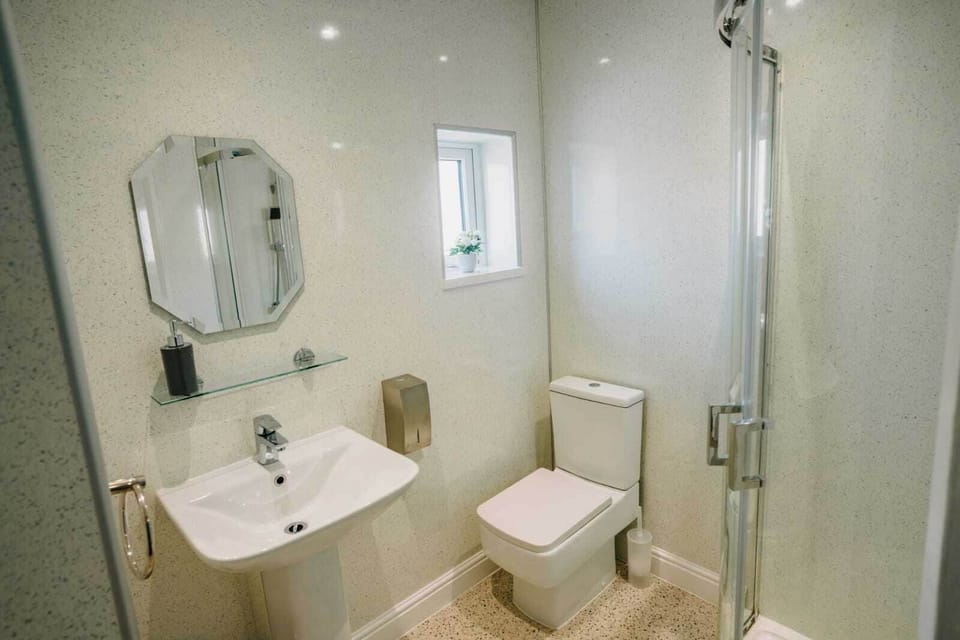 Shower, rainfall showerhead, hair dryer, towels