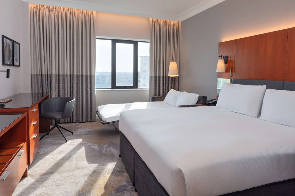 Family Room | Premium bedding, in-room safe, desk, iron/ironing board