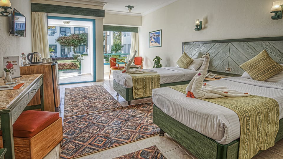 Standard Room, Garden View | Egyptian cotton sheets, down comforters, pillowtop beds, minibar