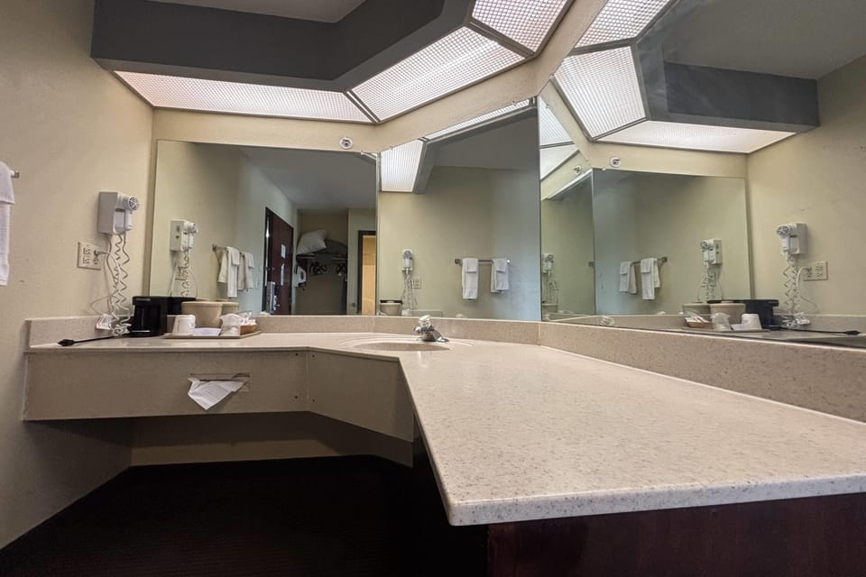 Deluxe Room, 2 Queen Beds, Non Smoking (2 Queen Beds with sofa bed) | Bathroom | Combined shower/tub, hair dryer, towels