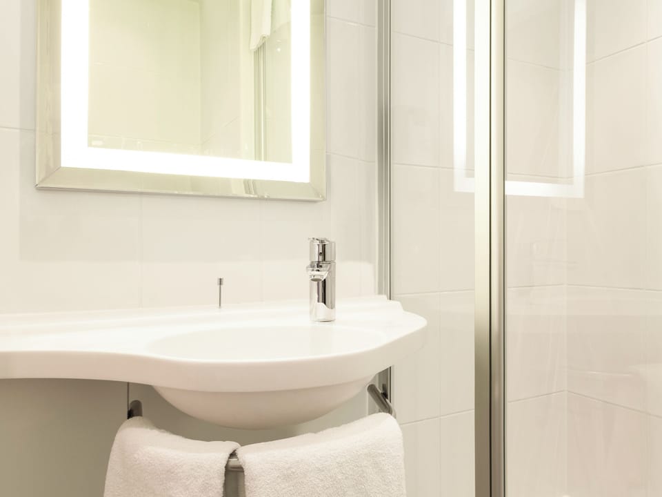 Shower, eco-friendly toiletries, hair dryer, towels