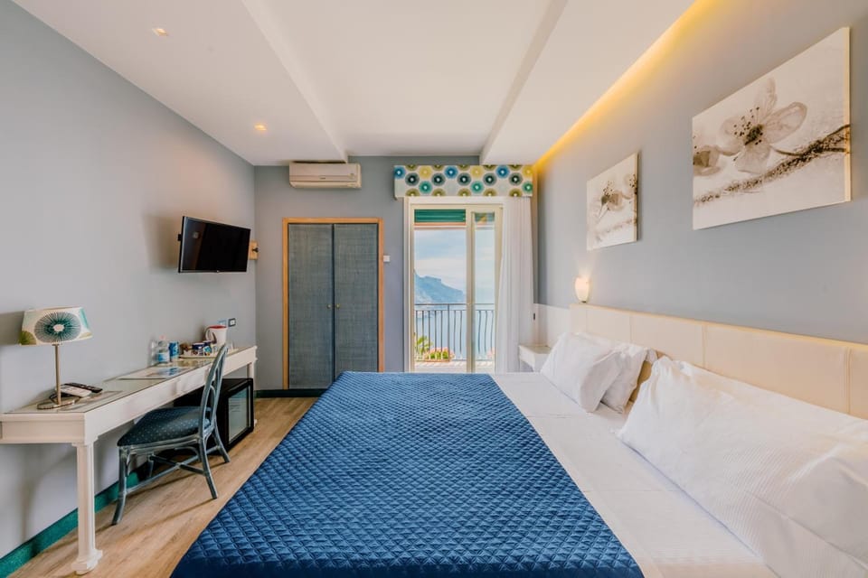 Large Deluxe Double Room, Sea View | Premium bedding, minibar, desk, laptop workspace