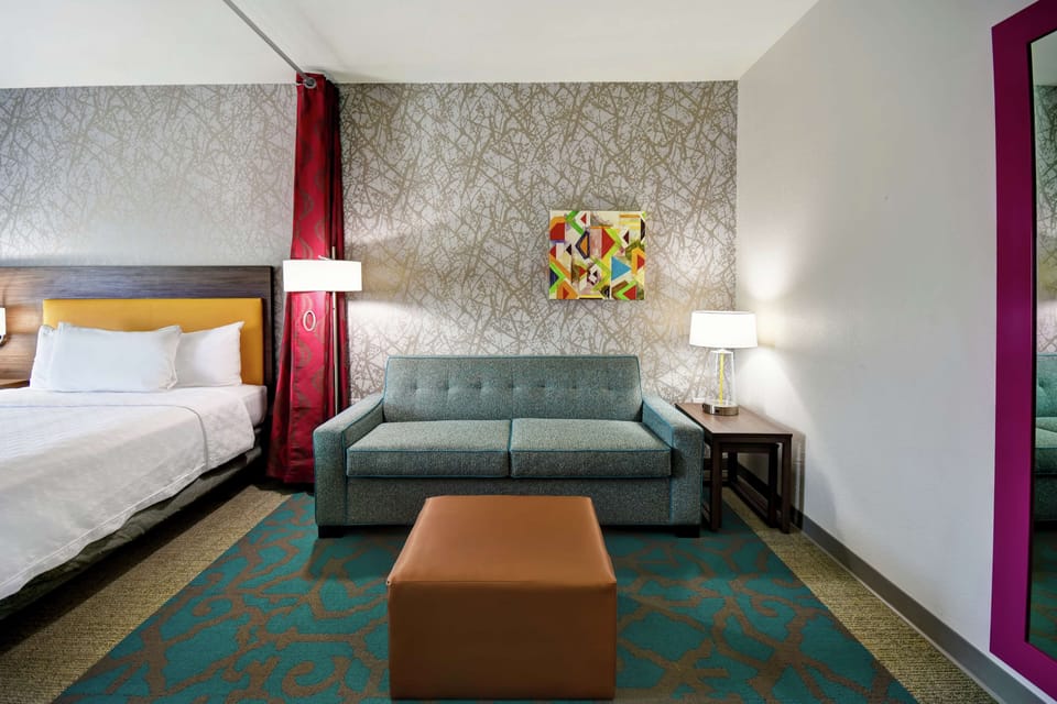 Studio Suite, 1 King Bed, Non Smoking | Living area | 42-inch flat-screen TV with cable channels, TV, MP3 dock