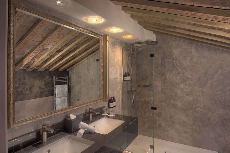 Rainfall showerhead, designer toiletries, hair dryer, bathrobes