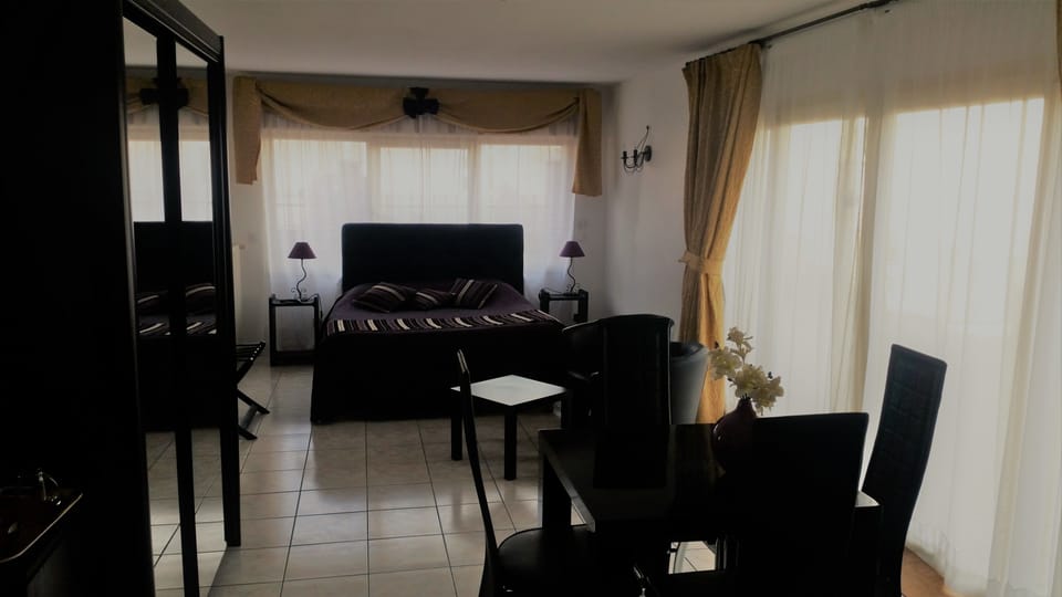 Quadruple Room, Accessible | Living area | Flat-screen TV