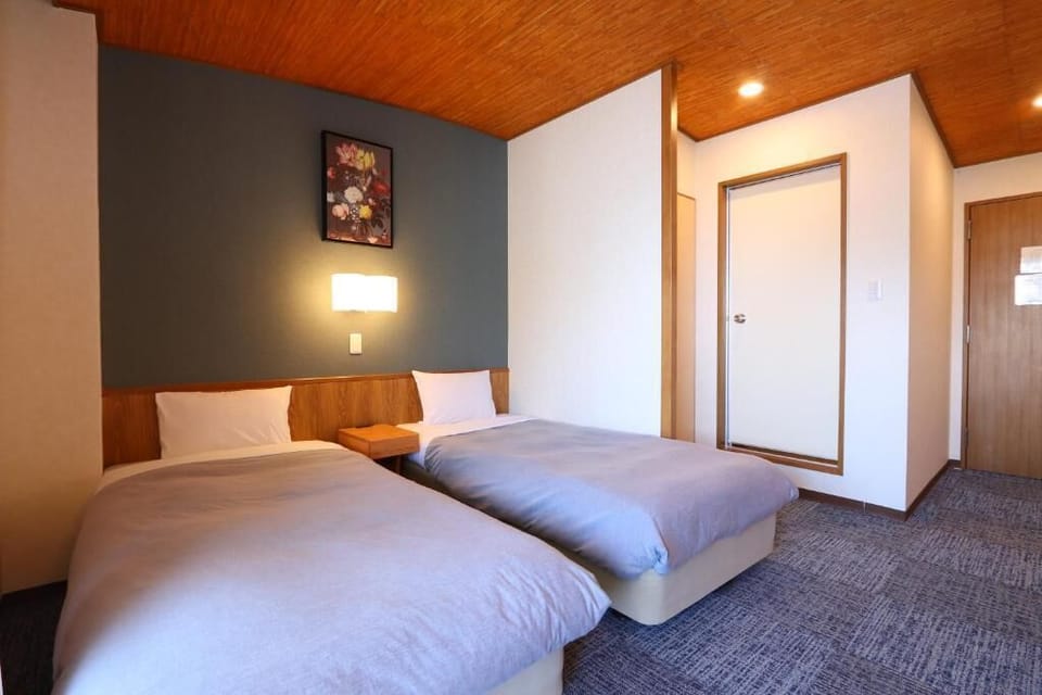 Family Quadruple Room, Non Smoking, Sea View | In-room safe, desk, laptop workspace, blackout drapes