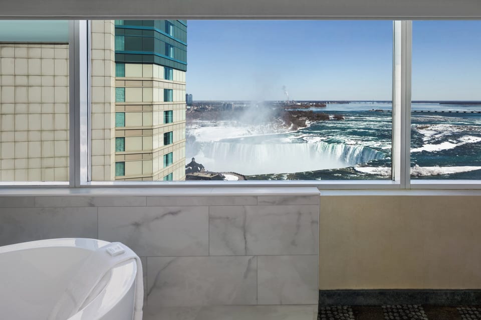 Standard Room, 1 King Bed, Jetted Tub (Falls View) | Desk, blackout drapes, iron/ironing board, free cribs/infant beds