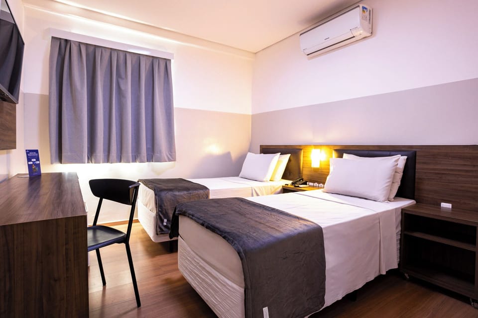 Economy Twin Room, 2 Twin Beds | Minibar, free WiFi, bed sheets