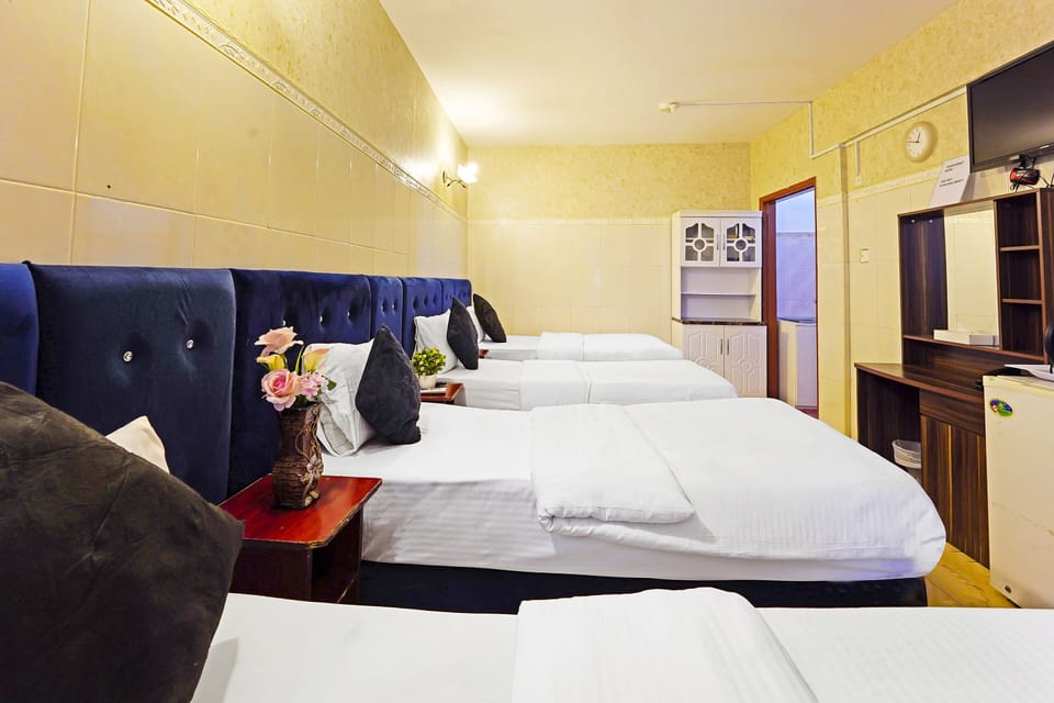Quadruple Room | Minibar, in-room safe, soundproofing, iron/ironing board