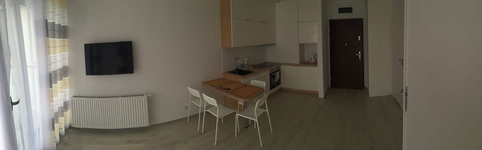 Apartment (Widokowy) | Living area | Flat-screen TV