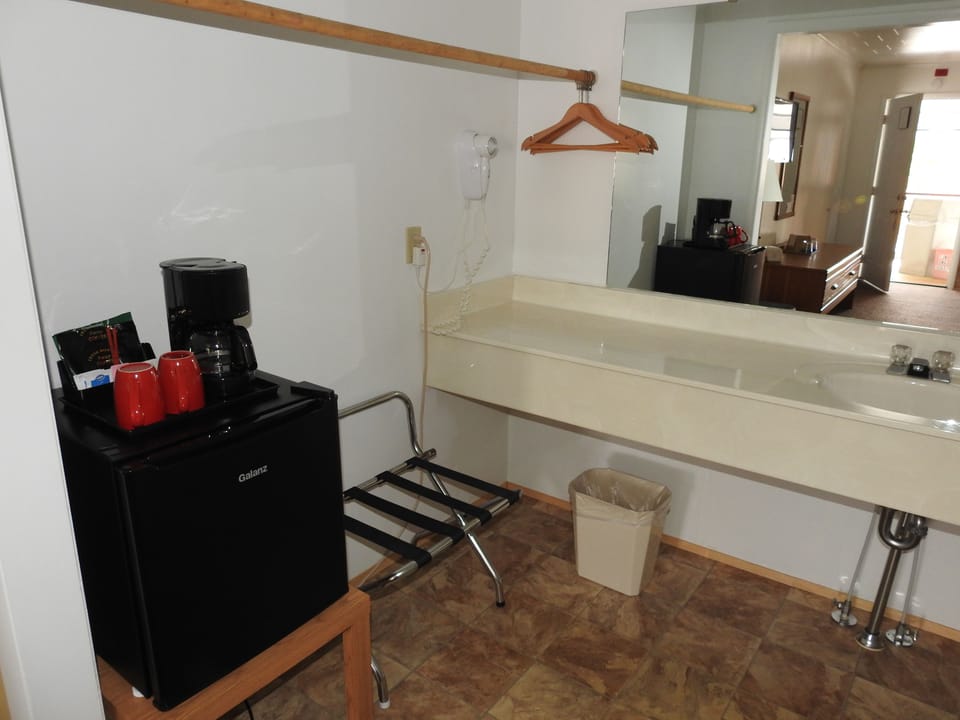 Room, 1 King Bed, Refrigerator | Bathroom sink