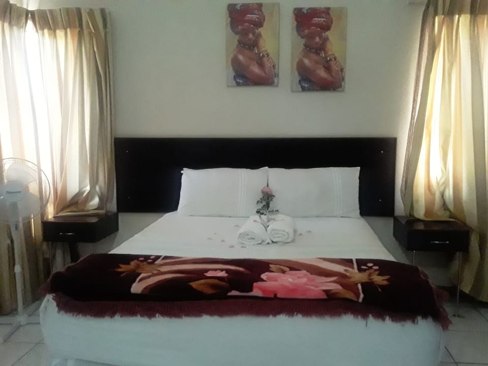 Basic Quadruple Room, Garden View | Desk, laptop workspace, iron/ironing board (on request), WiFi (free)